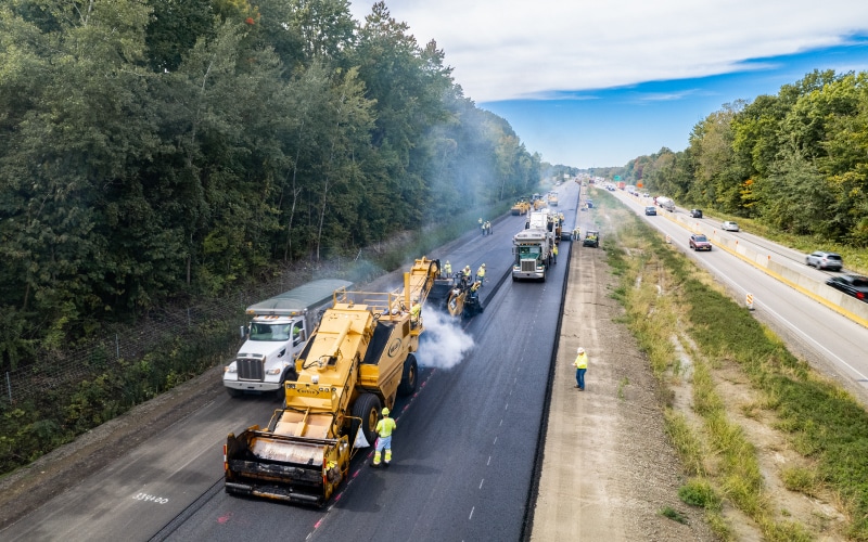 aerial view of the lindy pavement team laying asphalt on a highway